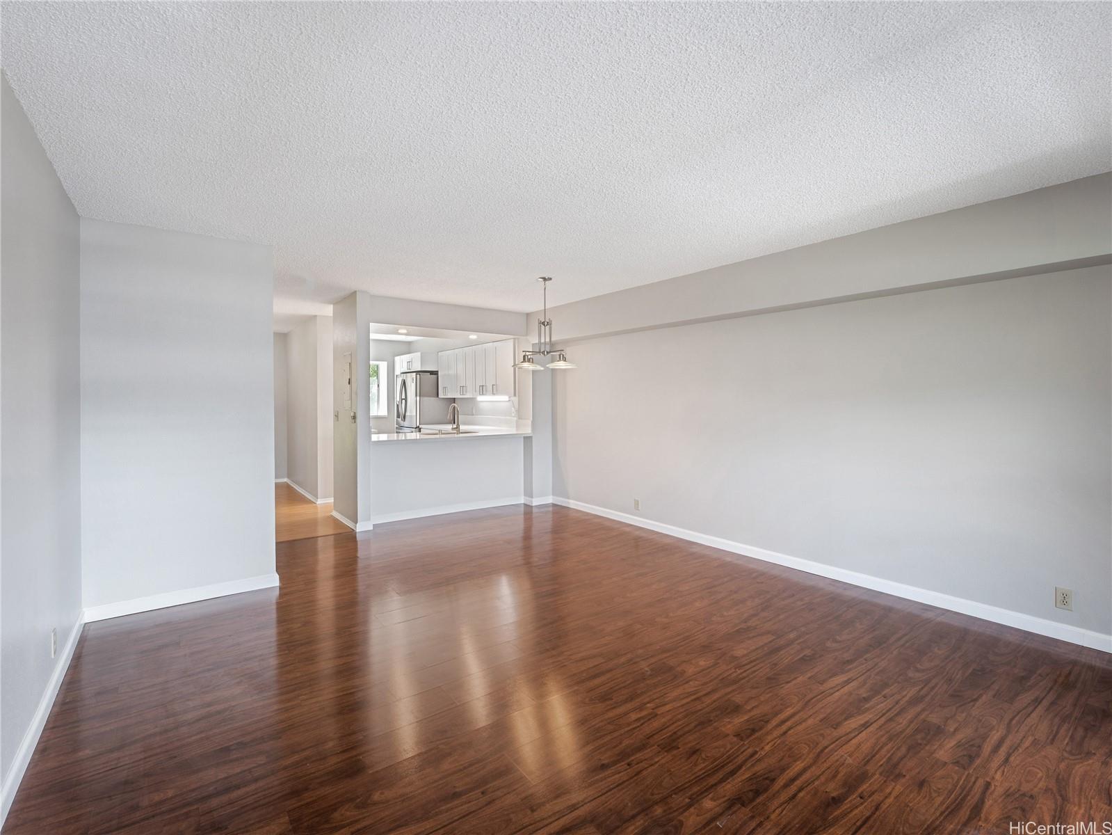 98-941 Moanalua Road, Unit 403 Aiea, HI 96701 - Photo 4 of 25 a view of empty room with wooden floor