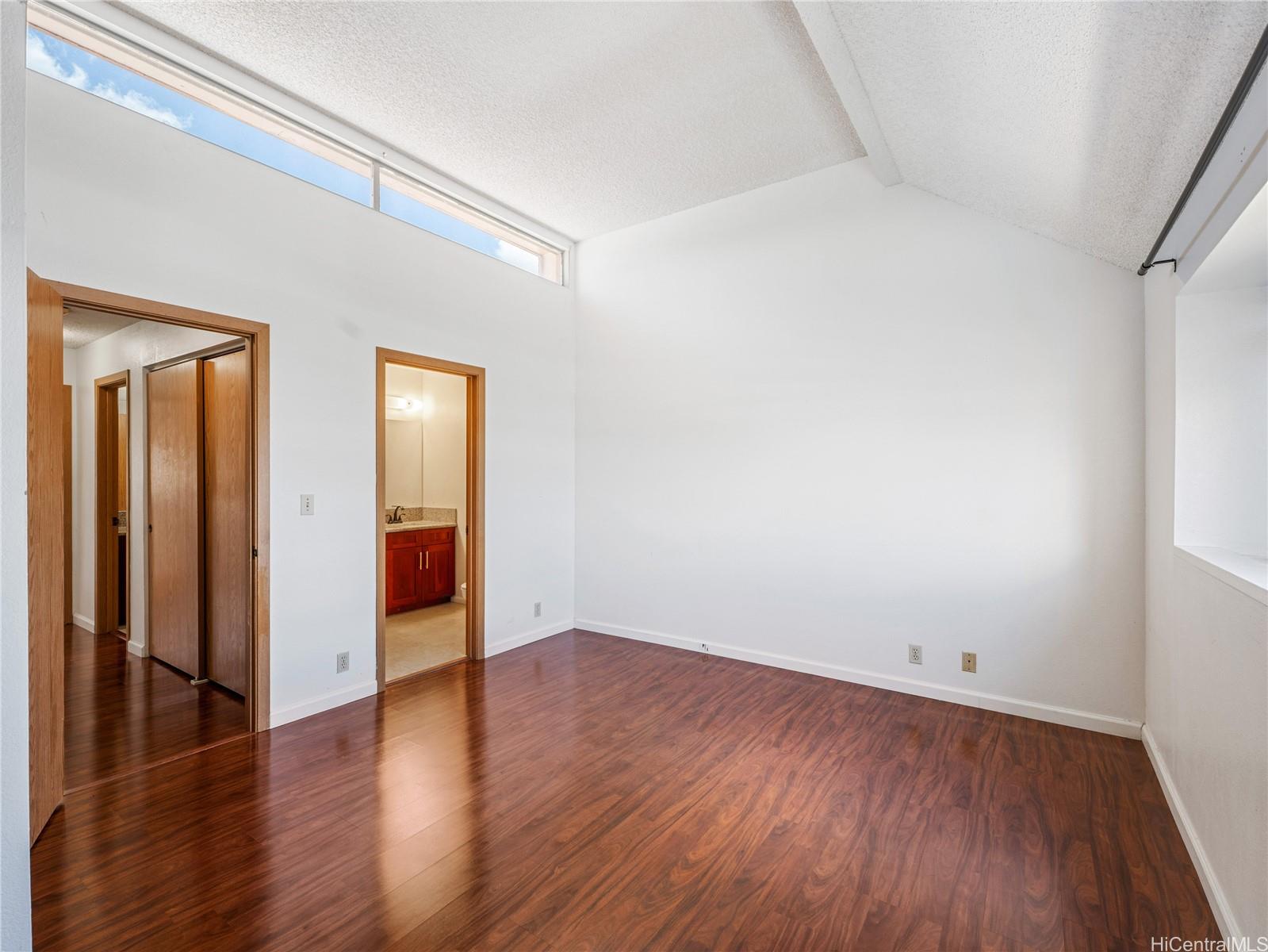 98-941 Moanalua Road, Unit 403 Aiea, HI 96701 - Photo 7 of 25 a view of an empty room with wooden floor