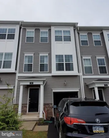 a view of a building with car parked