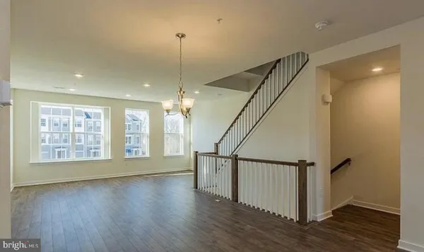 a kitchen with a sink appliances and cabinets