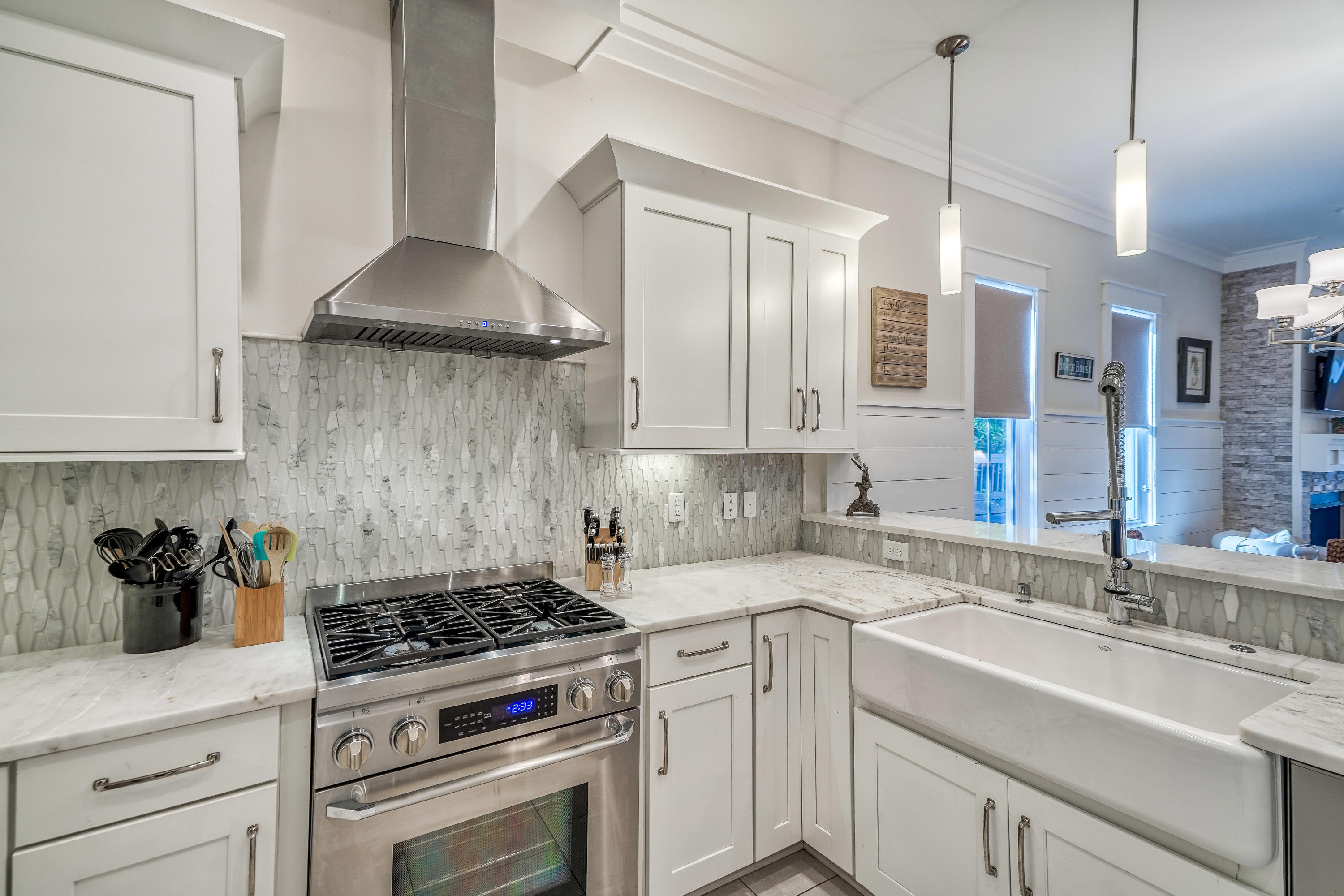 27 Pompano Street Inlet Beach, FL 32461 - Photo 13 of 64 a kitchen with stainless steel appliances a sink stove and cabinets