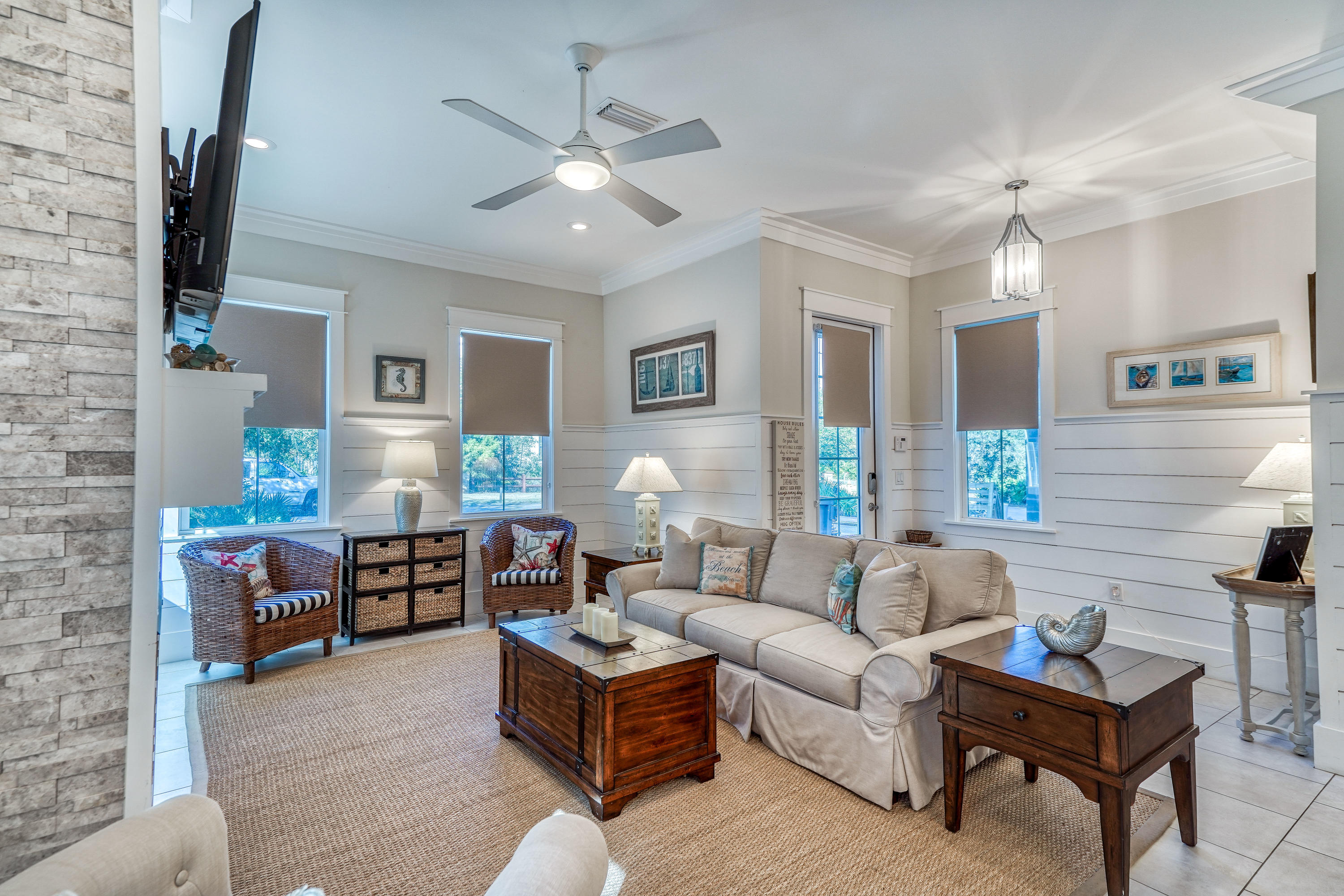 27 Pompano Street Inlet Beach, FL 32461 - Photo 3 of 64 a living room with furniture a chandelier and a flat screen tv