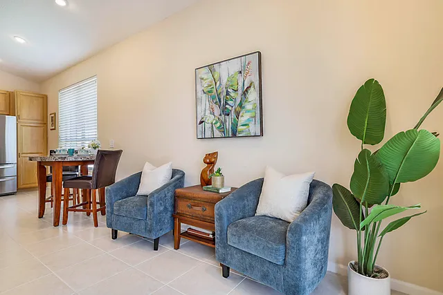 a kitchen with granite countertop a sink cabinets and stainless steel appliances