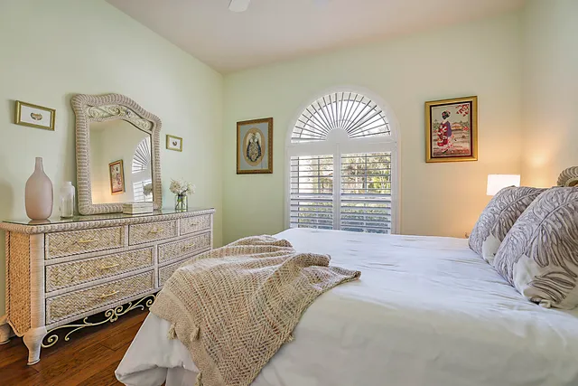 a bathroom with a sink a mirror a toilet and shower