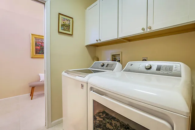 a view of a house with backyard and porch
