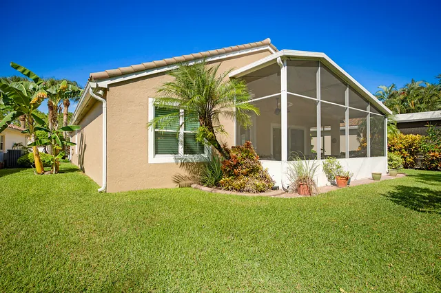 a view of a backyard with a garden and plants