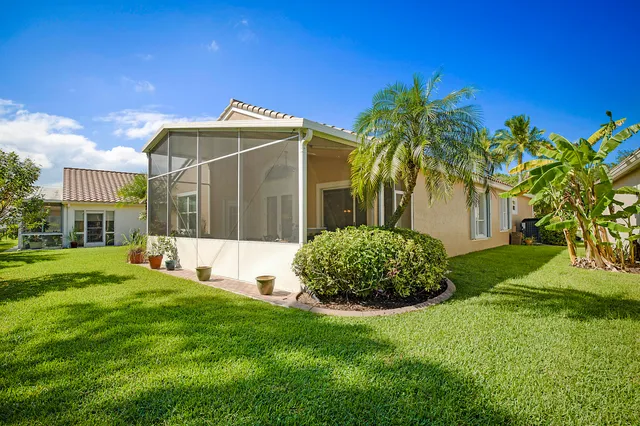 a view of a patio with a table and chairs