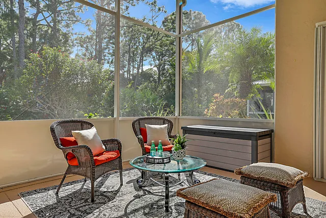 a view of a patio with table and chairs and couches