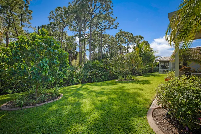 a view of house with outdoor space and garden