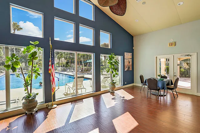 a view of a work space with furniture window and wooden floor