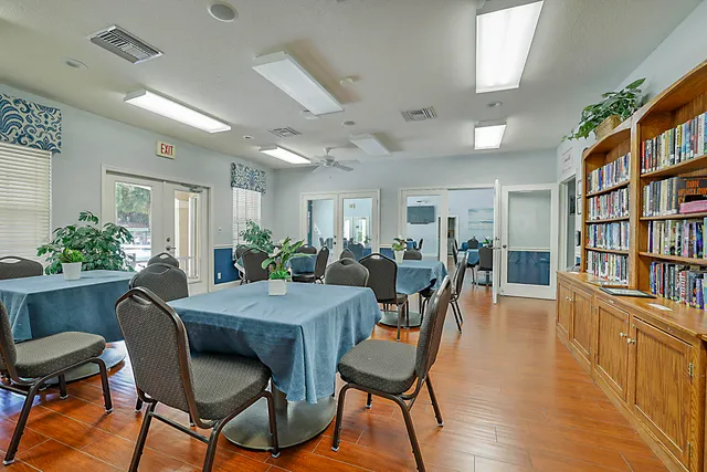 a kitchen with refrigerator and cabinets