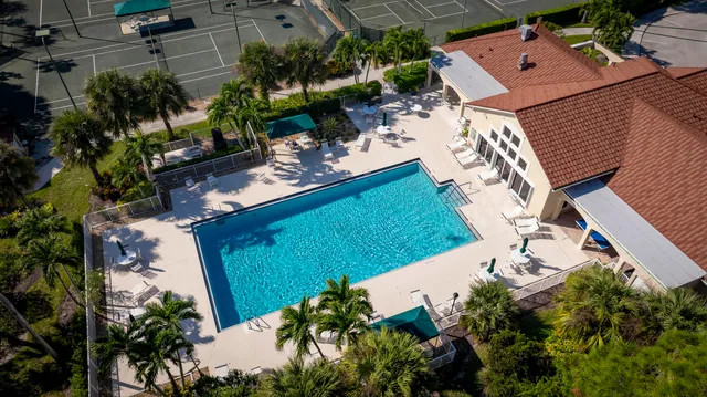 a view of a swimming pool with a yard