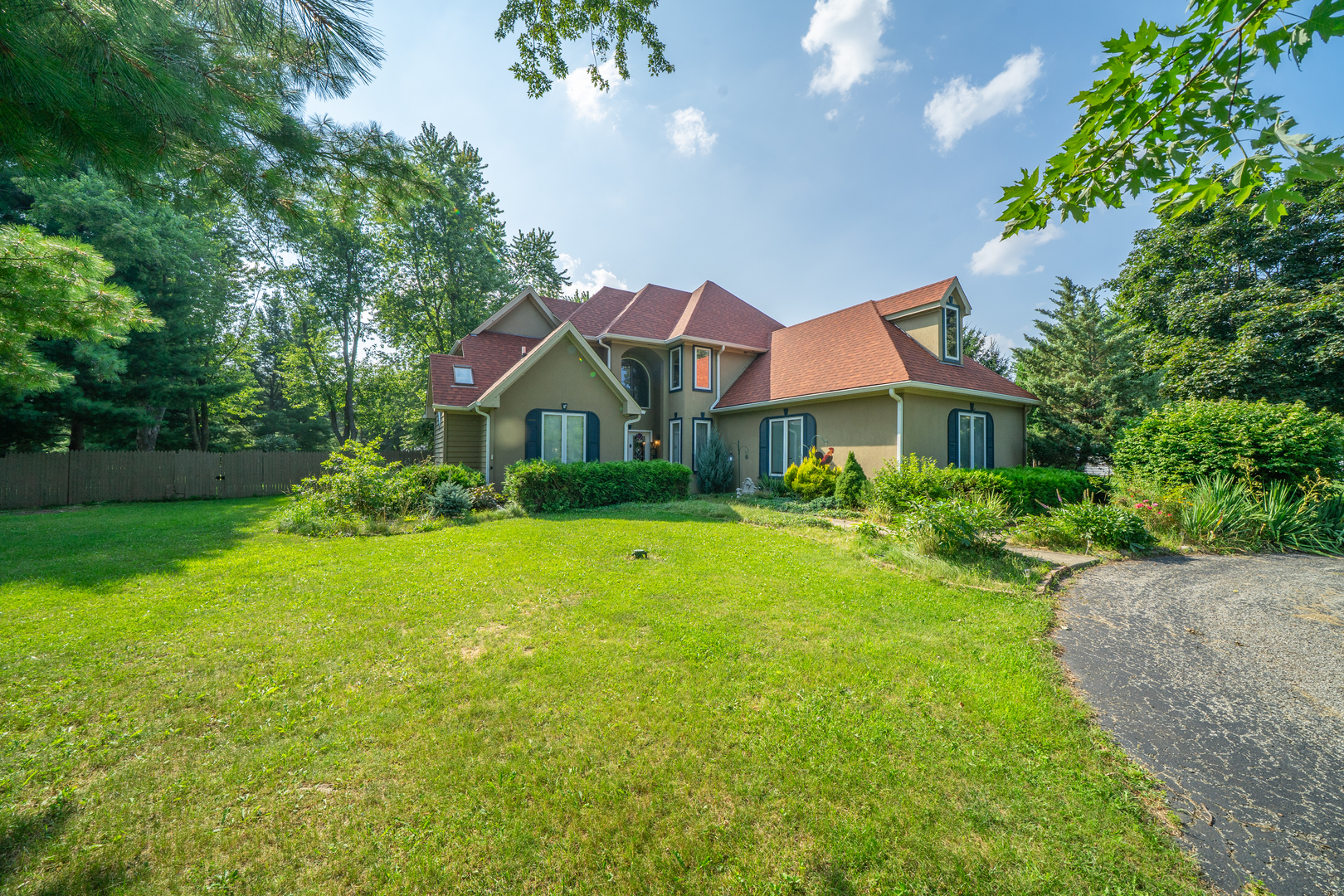 9817 North Hunters Lane Spring Grove, IL 60081 - Photo 1 of 73 a front view of a house with yard and green space