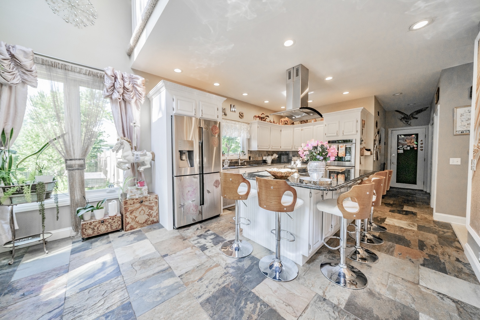 9817 North Hunters Lane Spring Grove, IL 60081 - Photo 12 of 73 a kitchen with stainless steel appliances kitchen island granite countertop a refrigerator and a stove top oven