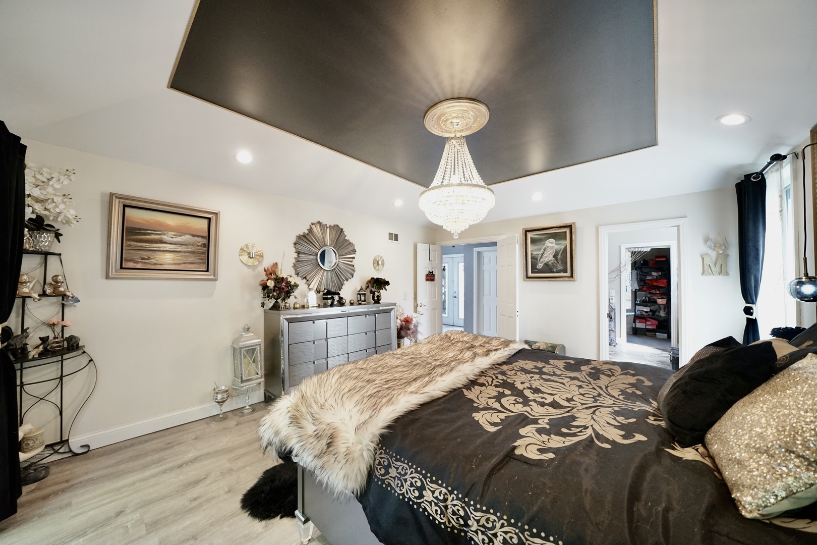 9817 North Hunters Lane Spring Grove, IL 60081 - Photo 22 of 73 a bedroom with a bed and a chandelier