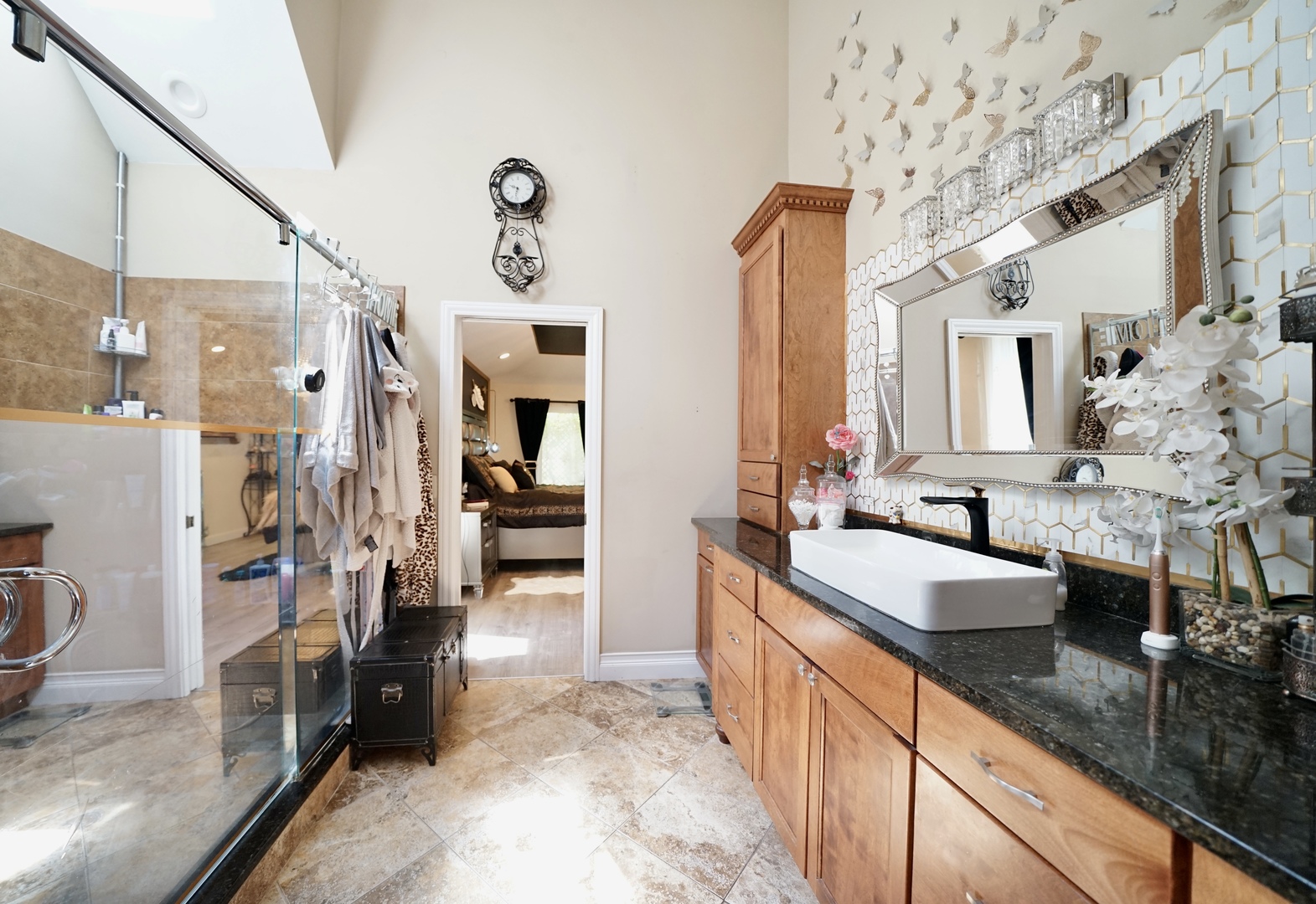 9817 North Hunters Lane Spring Grove, IL 60081 - Photo 25 of 73 a large bathroom with a granite countertop double vanity sink a mirror and a shower