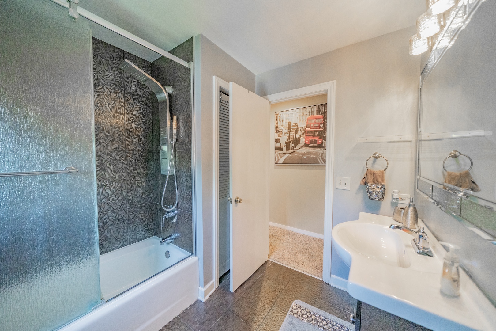 9817 North Hunters Lane Spring Grove, IL 60081 - Photo 38 of 73 a bathroom with a tub sink and mirror