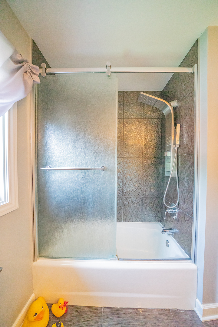 9817 North Hunters Lane Spring Grove, IL 60081 - Photo 44 of 73 a bathroom with a shower and a bath tub