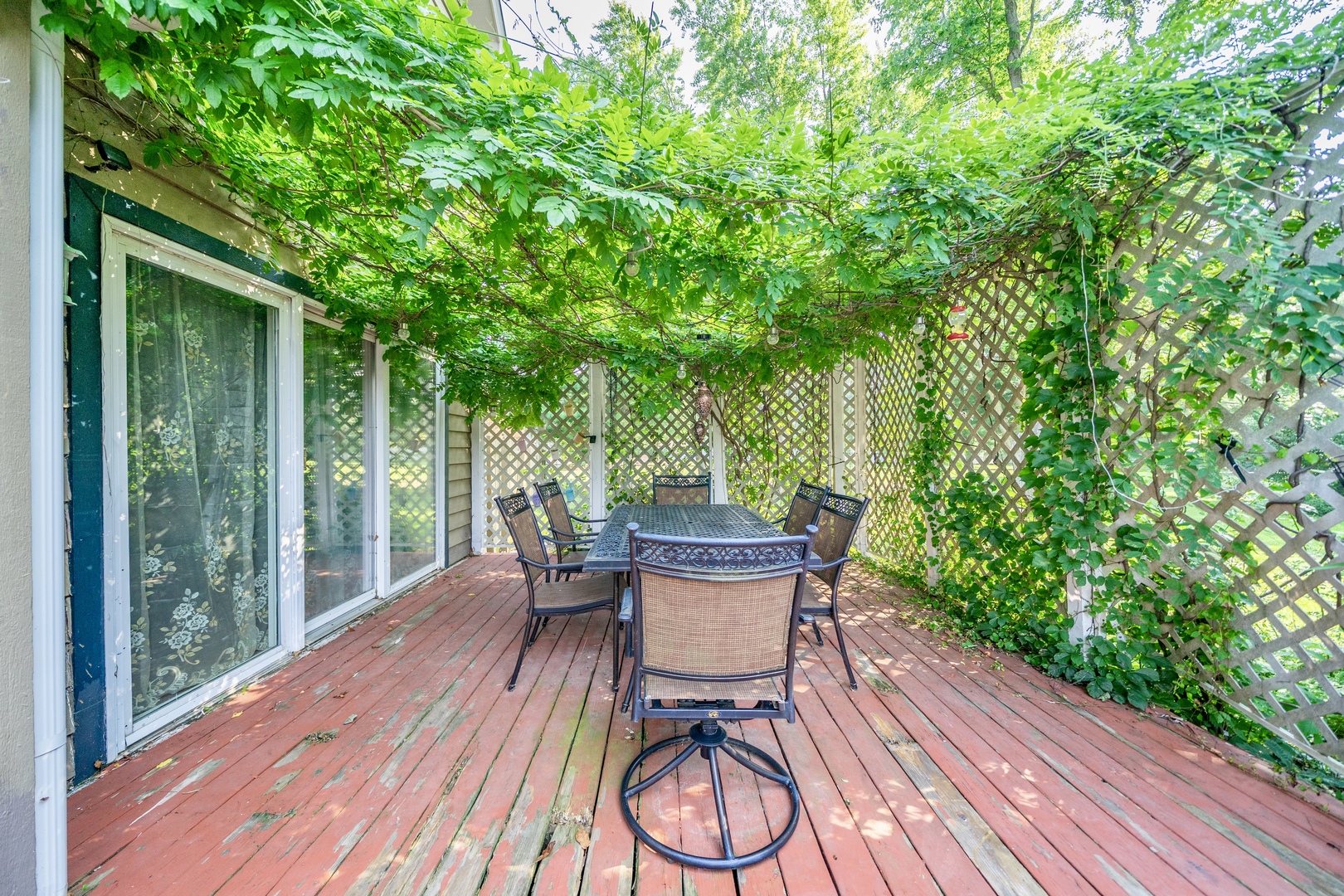 9817 North Hunters Lane Spring Grove, IL 60081 - Photo 61 of 73 a view of a table and chairs in patio with wooden floor