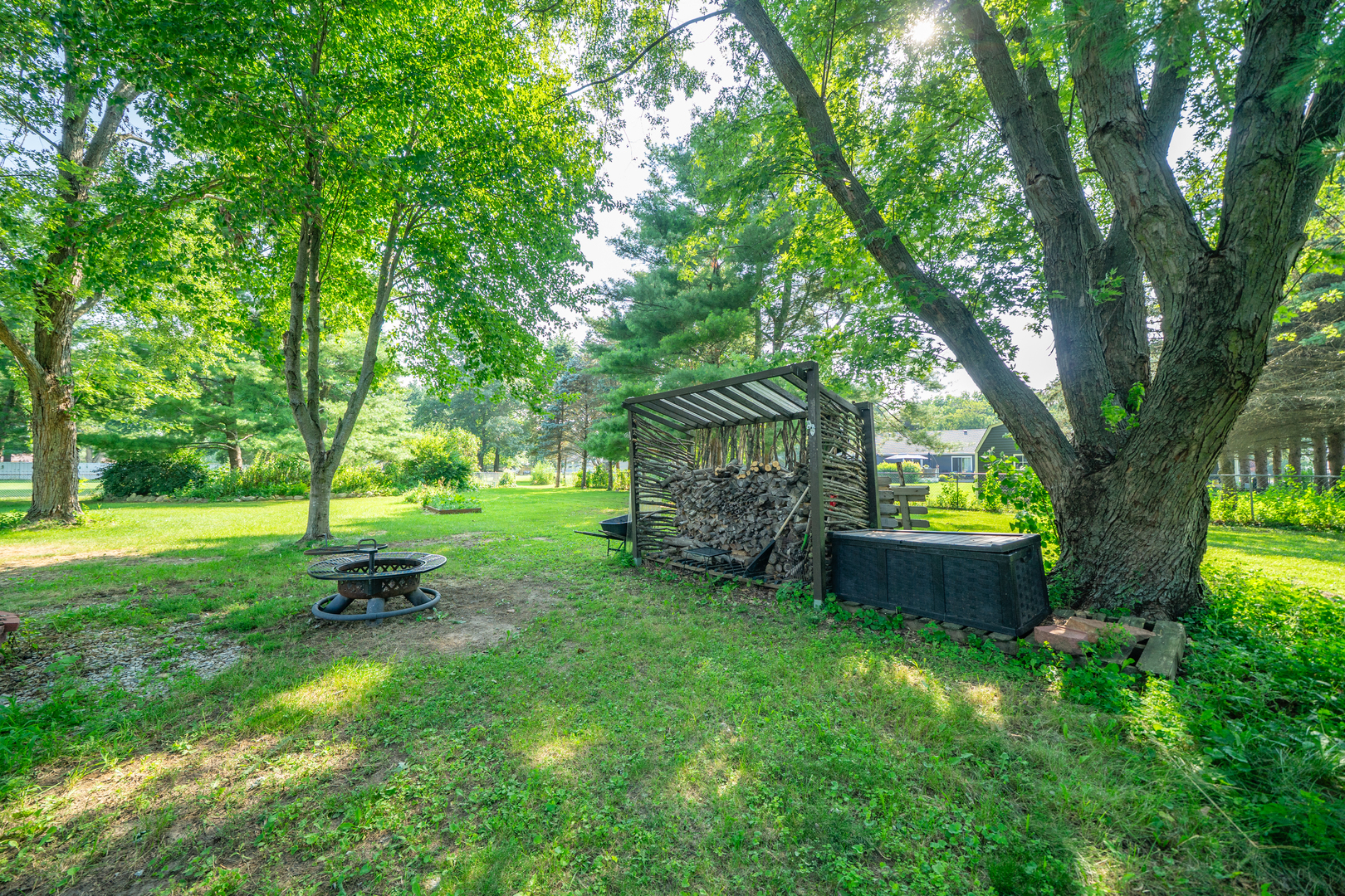 9817 North Hunters Lane Spring Grove, IL 60081 - Photo 65 of 73 a view of a backyard with large trees and a garden