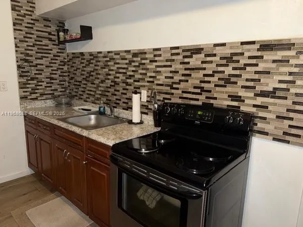 a close view of a stove top oven and sink