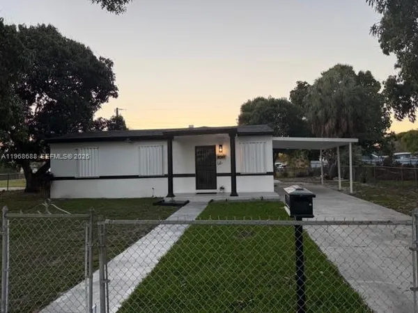 a view of a backyard with sitting area