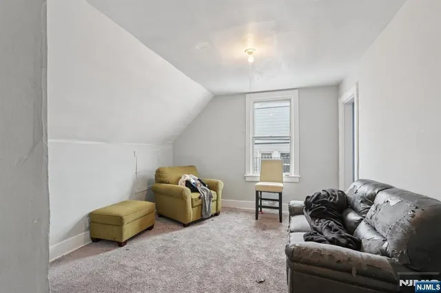 a room with furniture and gym equipment