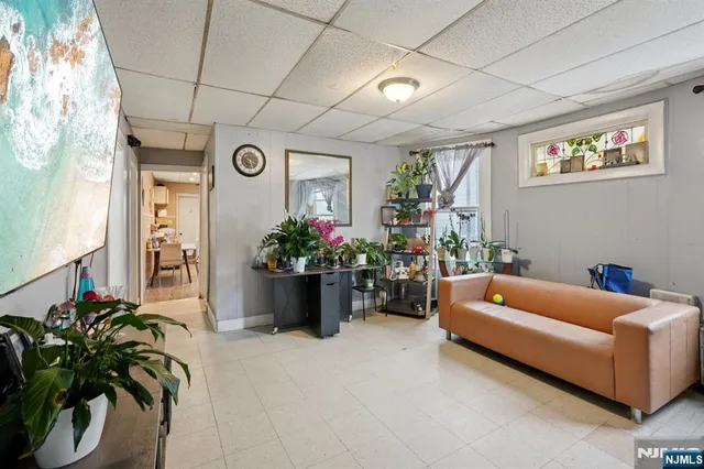 a large kitchen with sink refrigerator and cabinets
