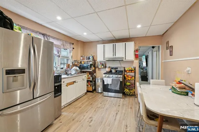 a bed room with a bed and a book shelf
