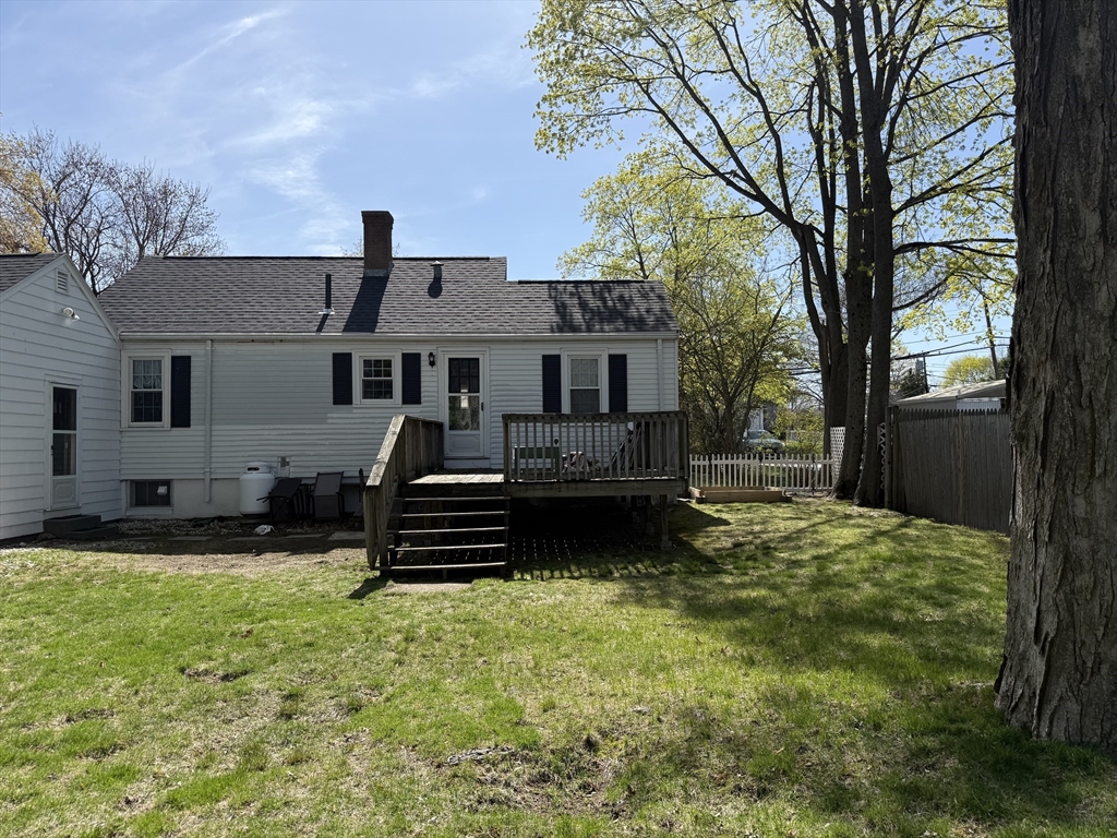 45 McPhee Road, Unit 1 Framingham, MA 01701 - Photo 11 of 11 a front view of a house with a yard