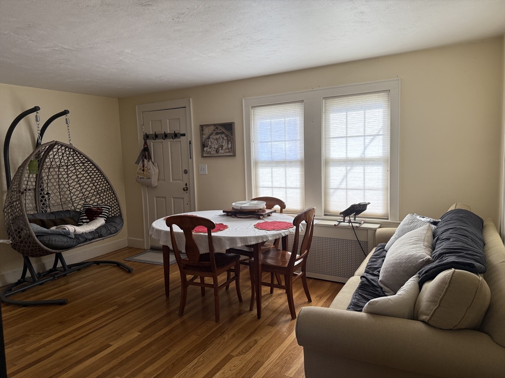 45 McPhee Road, Unit 1 Framingham, MA 01701 - Photo 4 of 11 a living room with furniture a rug and a window
