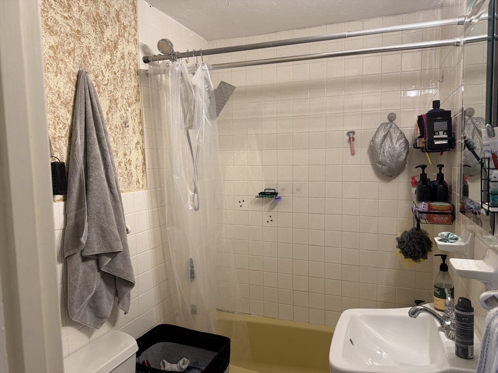 45 McPhee Road, Unit 1 Framingham, MA 01701 - Photo 7 of 11 a bathroom with a shower and a sink