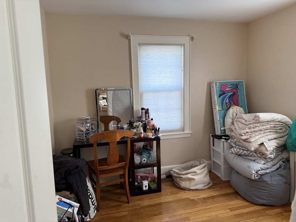 45 McPhee Road, Unit 1 Framingham, MA 01701 - Photo 8 of 11 a living room with furniture and a wooden floor