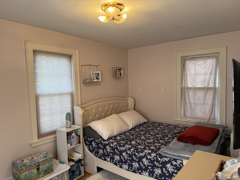 45 McPhee Road, Unit 1 Framingham, MA 01701 - Photo 9 of 11 a bedroom with a bed and a window