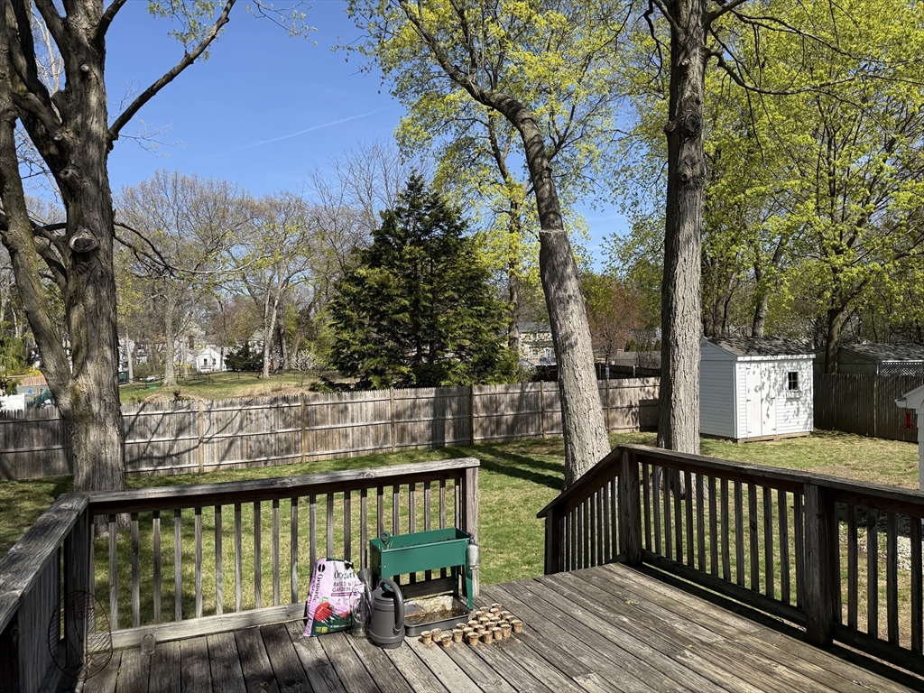 45 McPhee Road, Unit 1 Framingham, MA 01701 - Photo 10 of 11 a view of a wooden deck with large trees