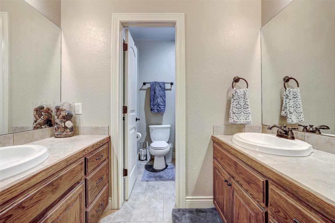 Undisclosed Address Georgetown, TX 78633 - Photo 27 of 38 Bathroom featuring a textured wall and two vanities