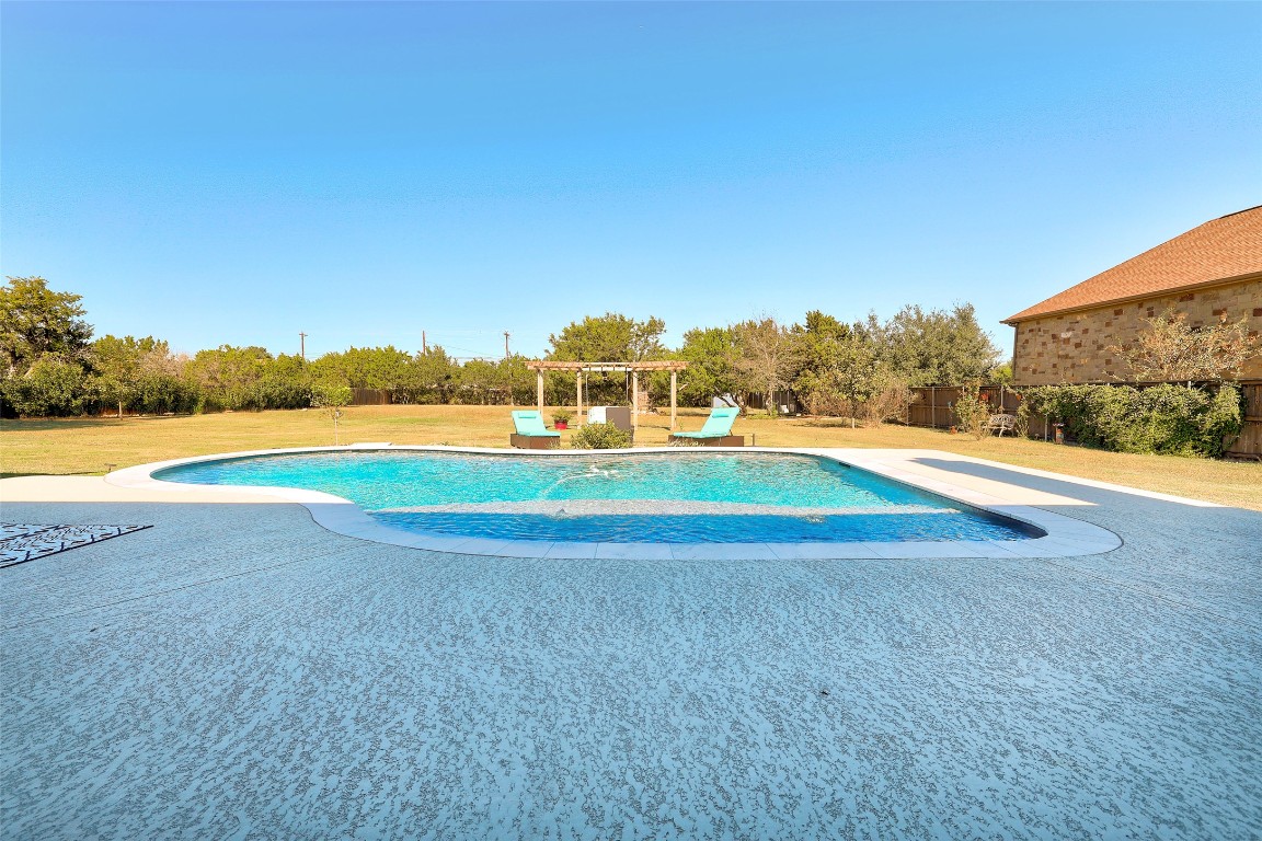 Undisclosed Address Georgetown, TX 78633 - Photo 31 of 38 Swimming pool with a patio area and a lawn