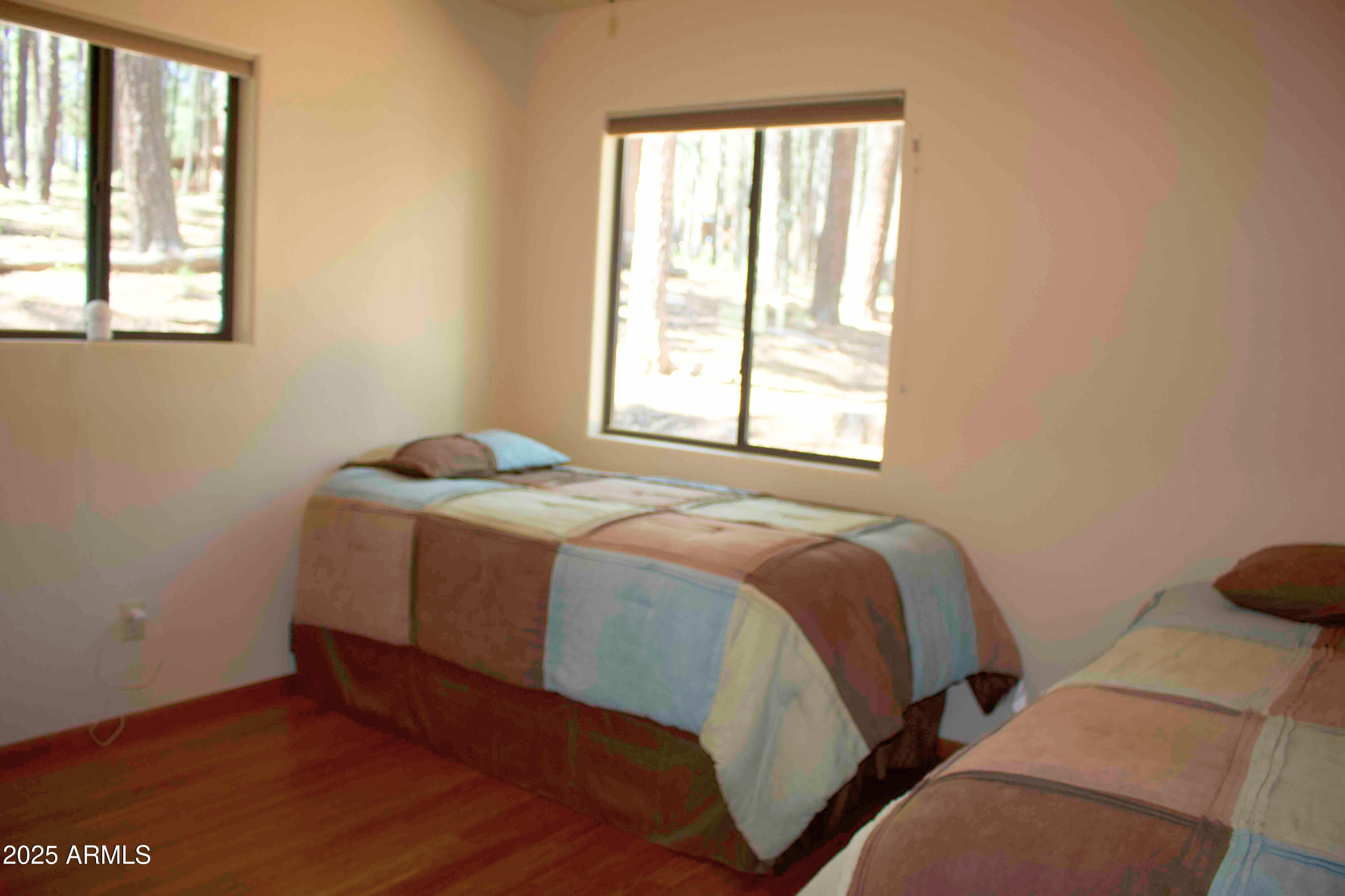 2592 Tom Loop Forest Lakes, AZ 85931 - Photo 13 of 25 a bed sitting in a bedroom next to a window