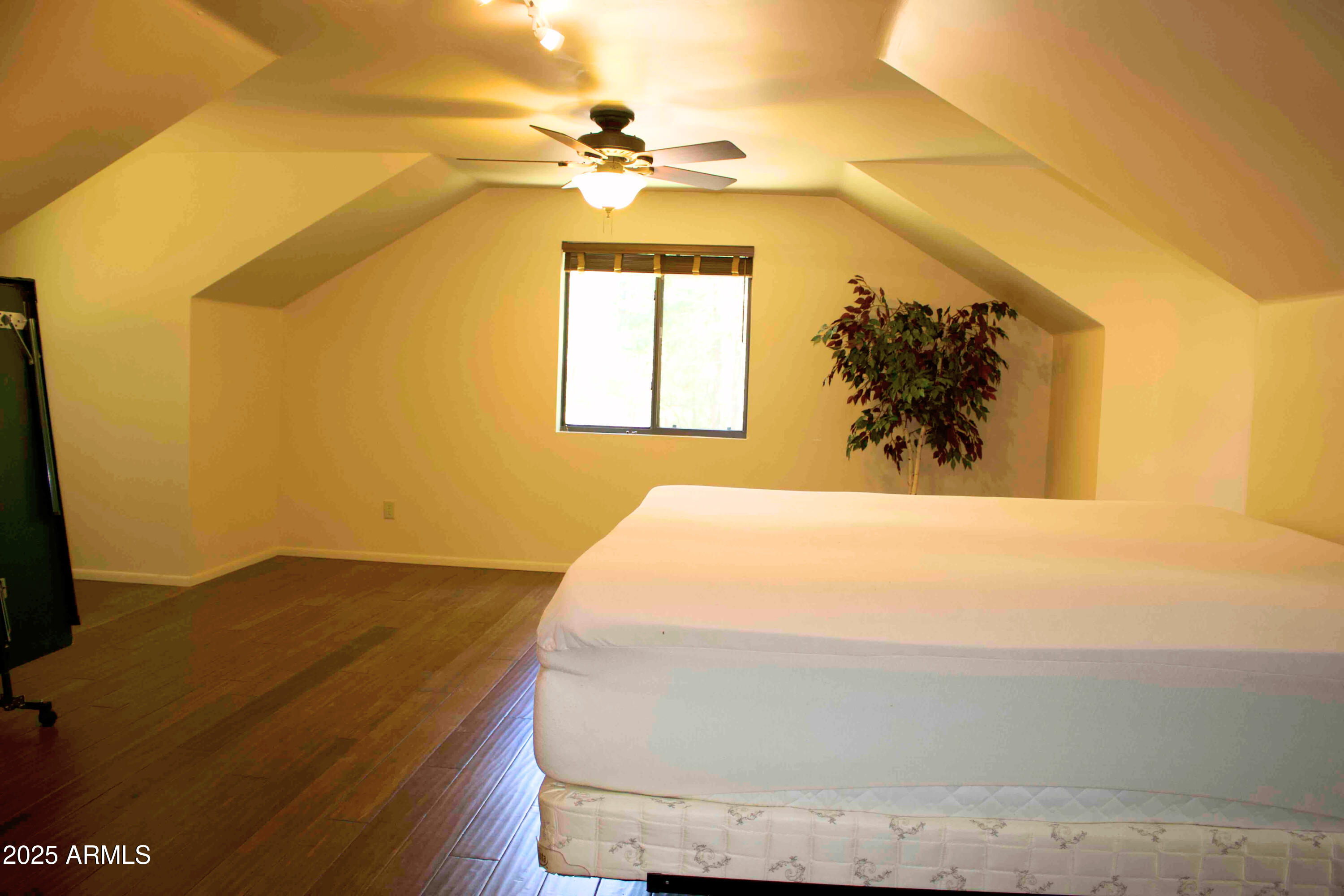 2592 Tom Loop Forest Lakes, AZ 85931 - Photo 15 of 25 a bedroom with a bed and a painting on the wall