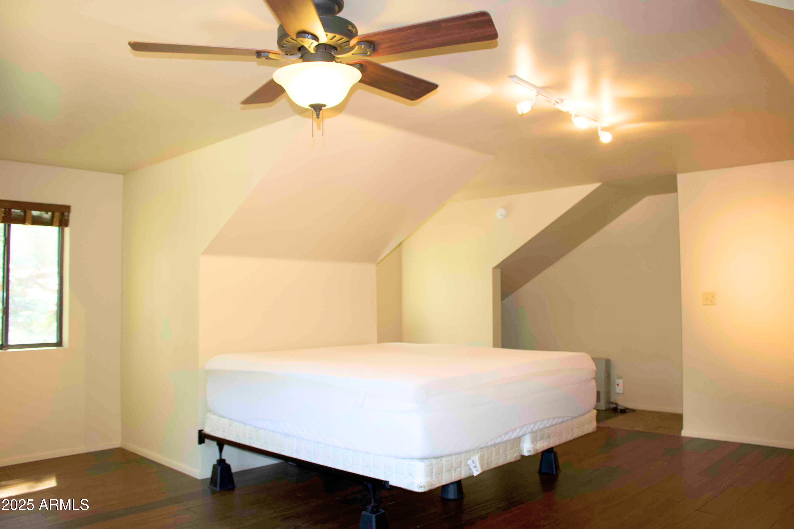 2592 Tom Loop Forest Lakes, AZ 85931 - Photo 16 of 25 a bed sitting in a bedroom next to a window