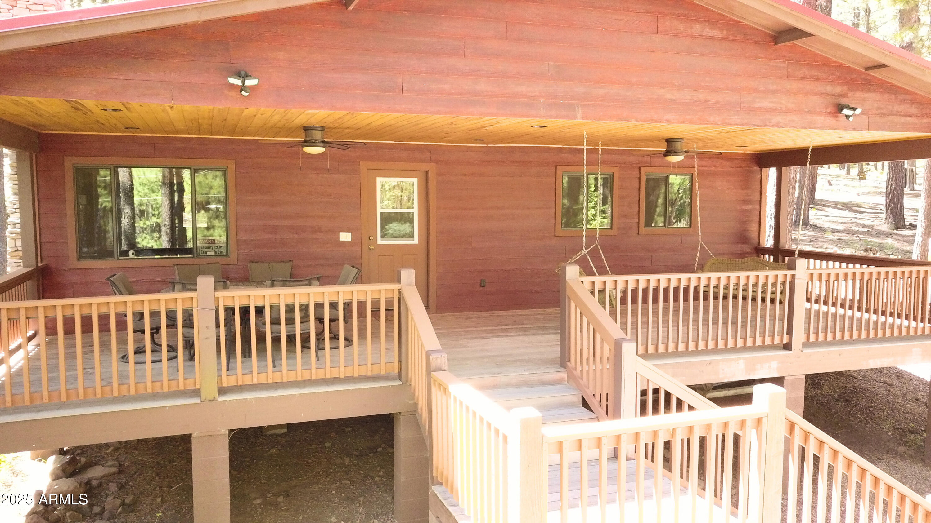 2592 Tom Loop Forest Lakes, AZ 85931 - Photo 3 of 25 a view of a brick house with a large window