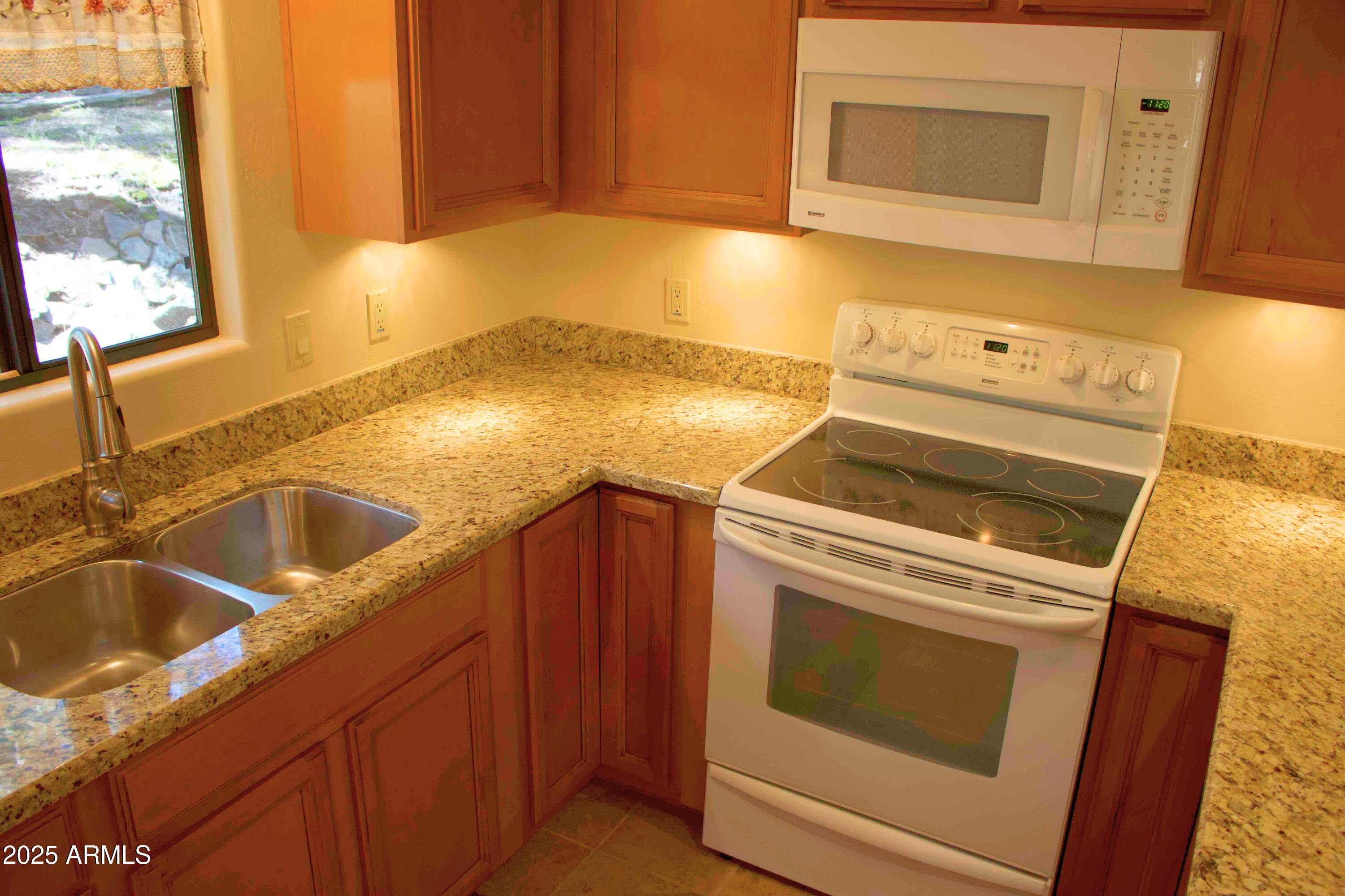 2592 Tom Loop Forest Lakes, AZ 85931 - Photo 7 of 25 a view of a kitchen with sink and washing machine