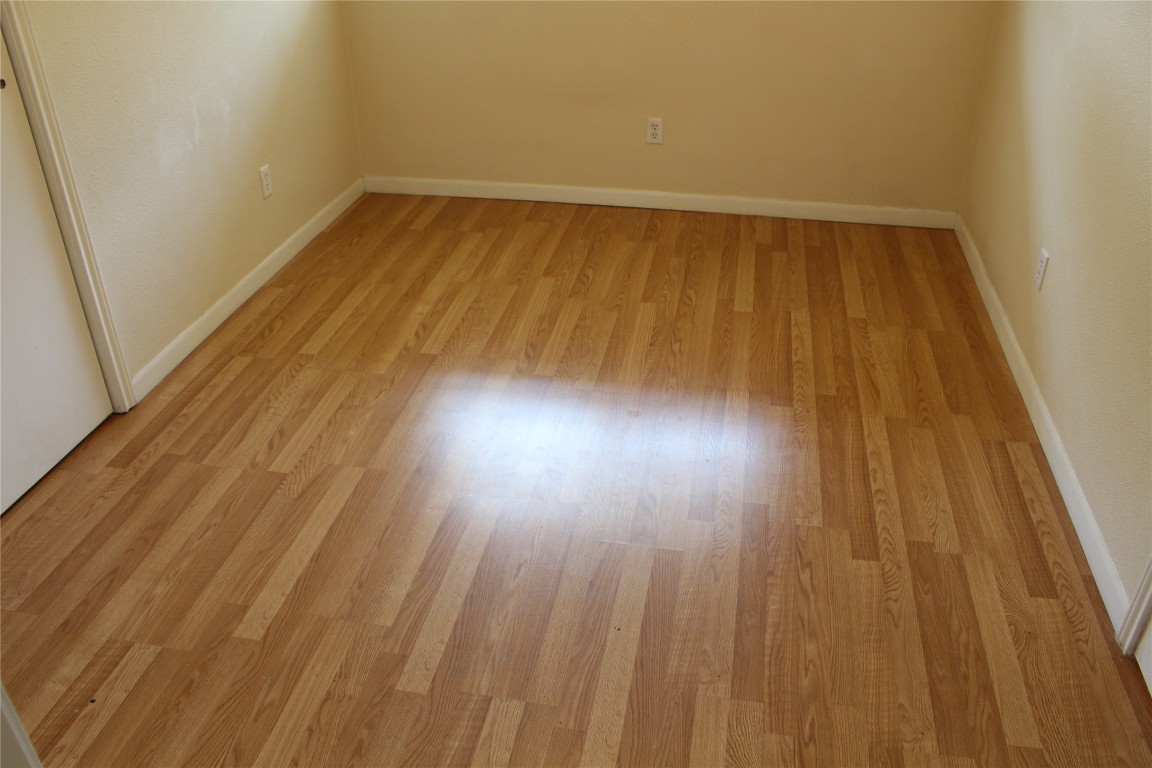 304 East 33rd Street, Unit 19 Austin, TX 78705 - Photo 11 of 15 a view of room with wooden floor