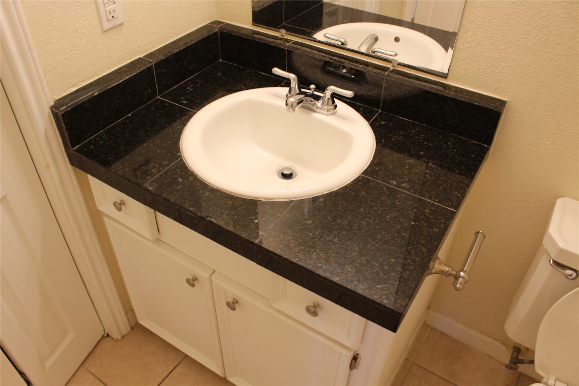 304 East 33rd Street, Unit 19 Austin, TX 78705 - Photo 12 of 15 a close view of a sink and washing machine