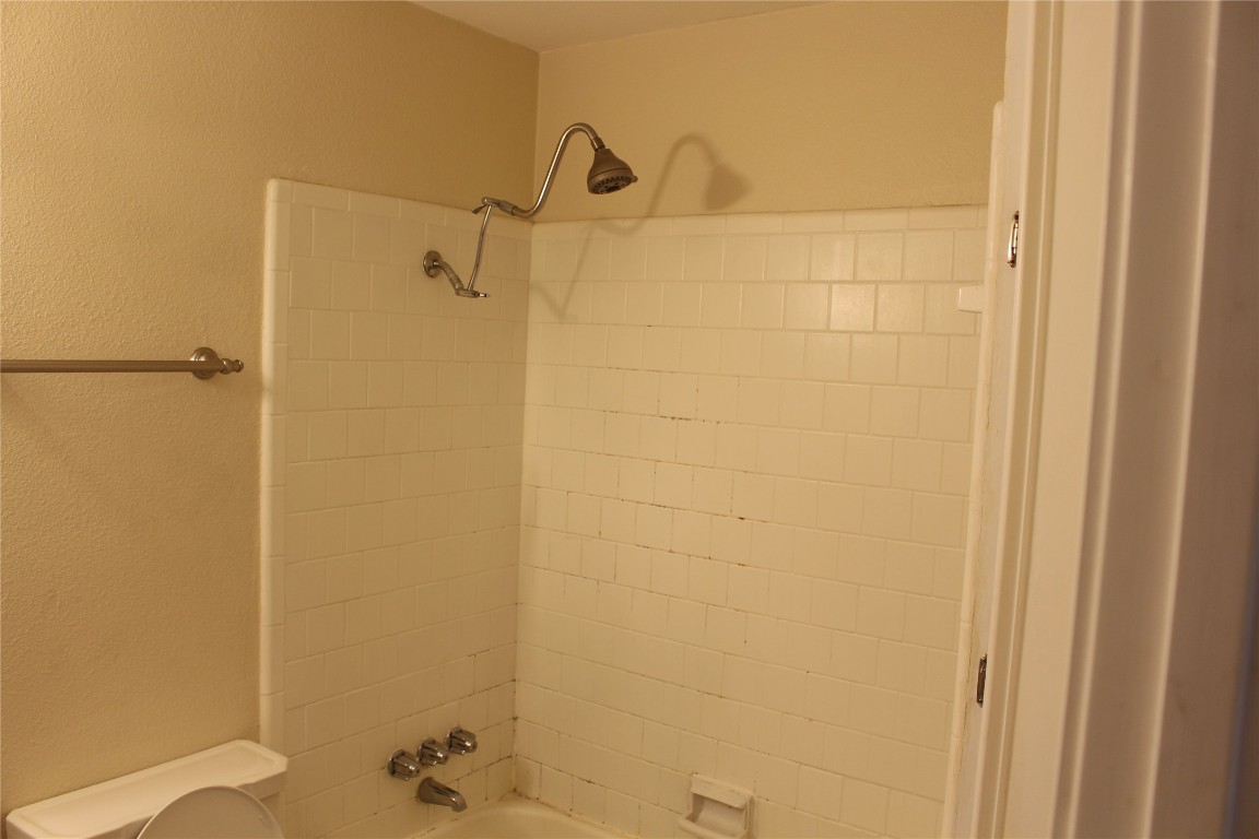 304 East 33rd Street, Unit 19 Austin, TX 78705 - Photo 14 of 15 a bathroom with a shower