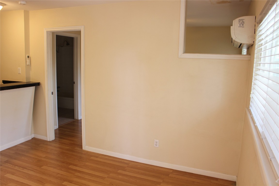 304 East 33rd Street, Unit 19 Austin, TX 78705 - Photo 3 of 15 a view of a small space with wooden floor and a window