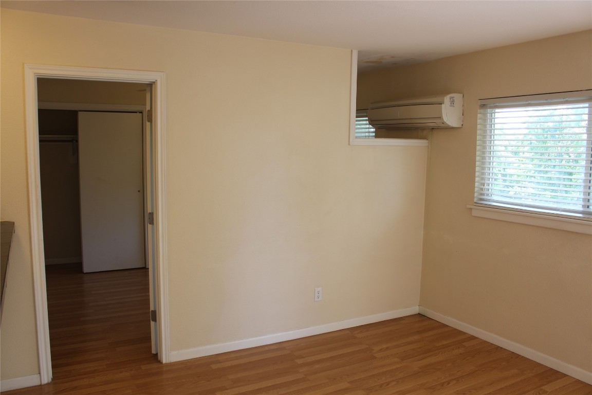 304 East 33rd Street, Unit 19 Austin, TX 78705 - Photo 4 of 15 a view of a small space with wooden floor and a window