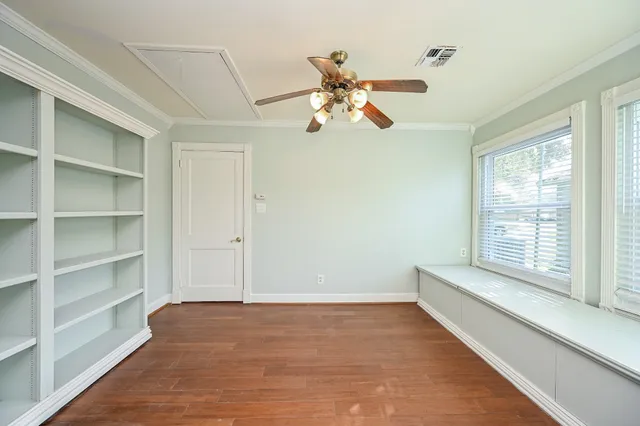 a view of an empty room and a window