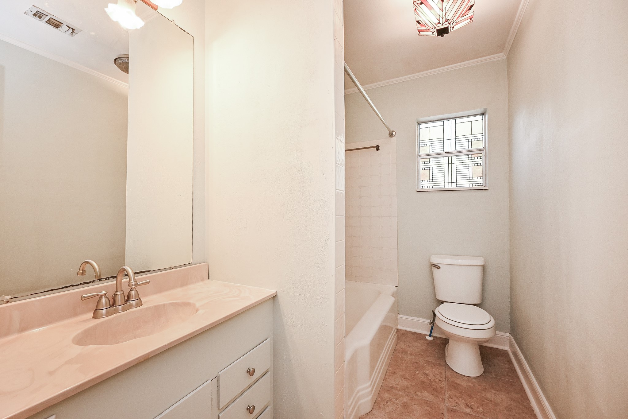 1707 Key Street Waller, TX 77484 - Photo 20 of 26 a bathroom with a granite countertop toilet a sink and a mirror