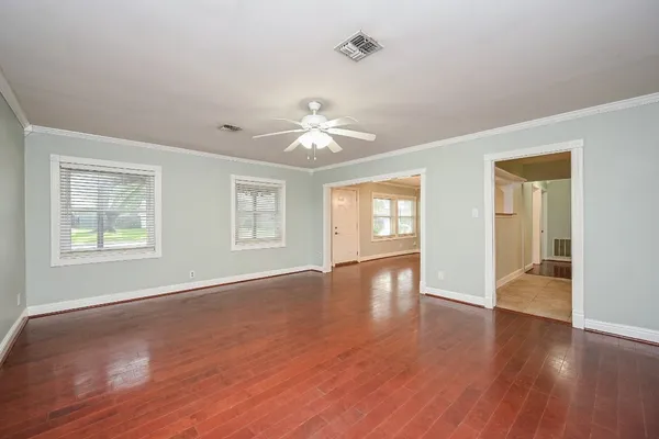 an entryway view with an empty room